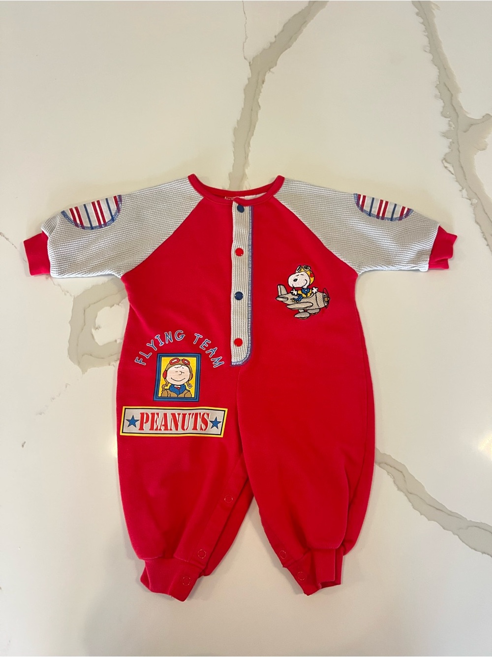Vintage 80's/90's Peanuts Snoopy Flying Team Baby Romper
6-9M Red Flying Ace